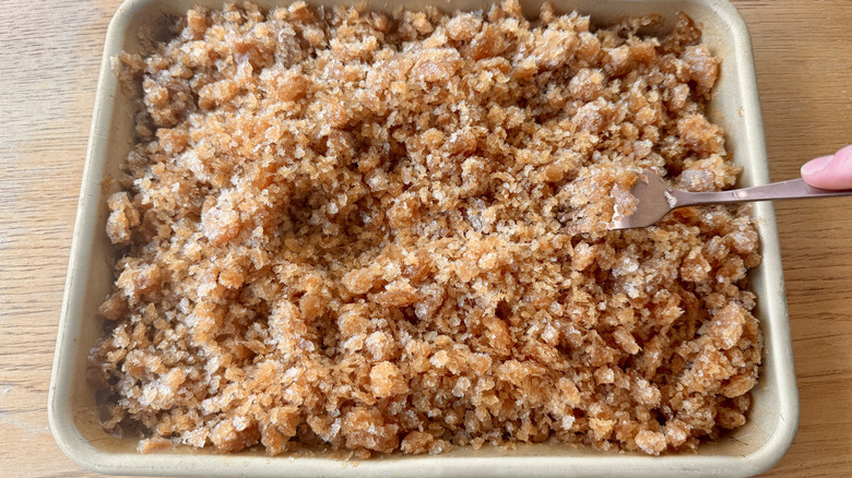 Scraping frozen coffee granita with a fork