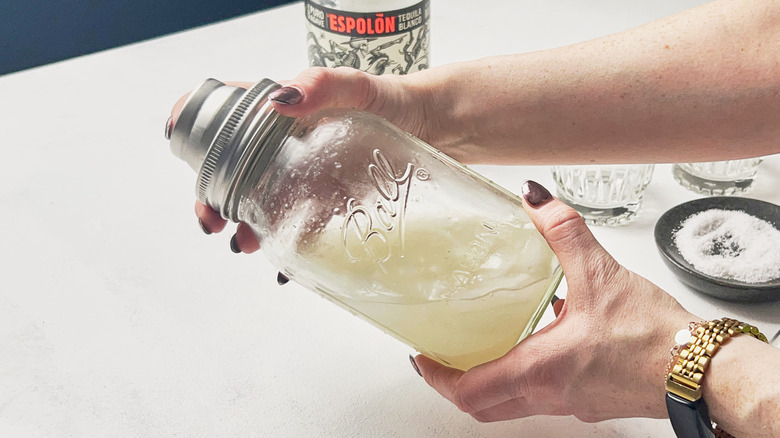 shaking cocktail in shaker