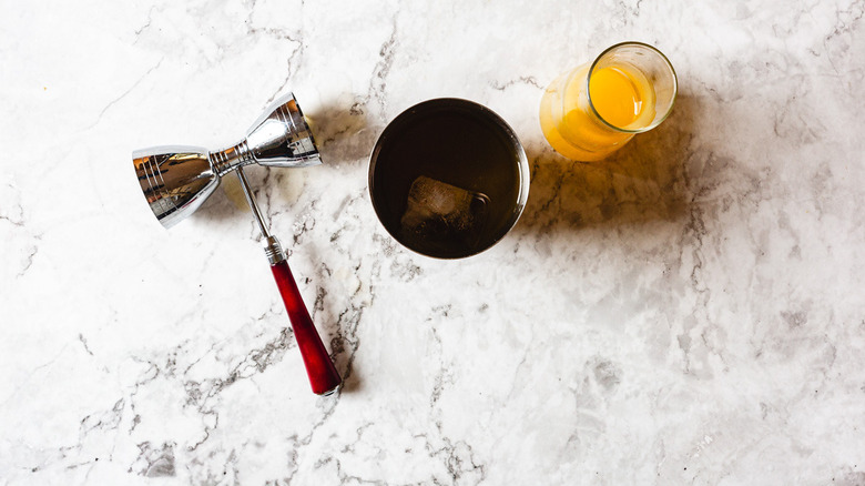 shaker with passion fruit in carafe