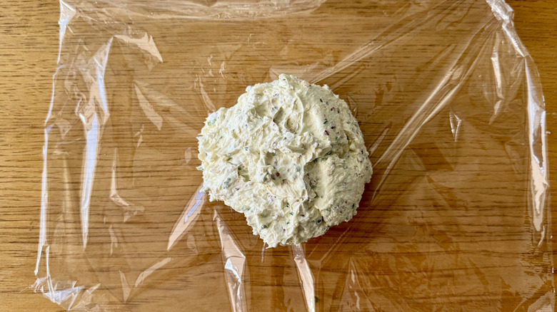 Forming cheese ball on plastic wrap