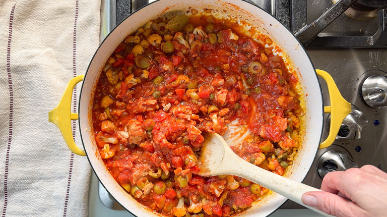 Romesco-y sauce simmering in pot on stovetop