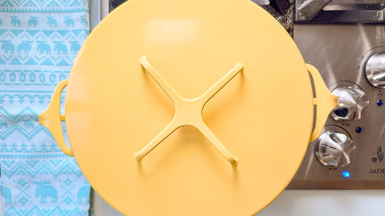 Yellow covered pot on stovetop