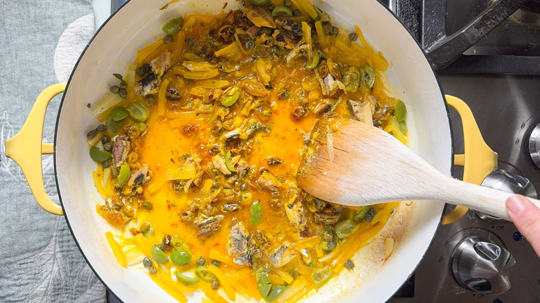 Breaking up sardines in high-protein pasta con le sarde (with sardines) sauce