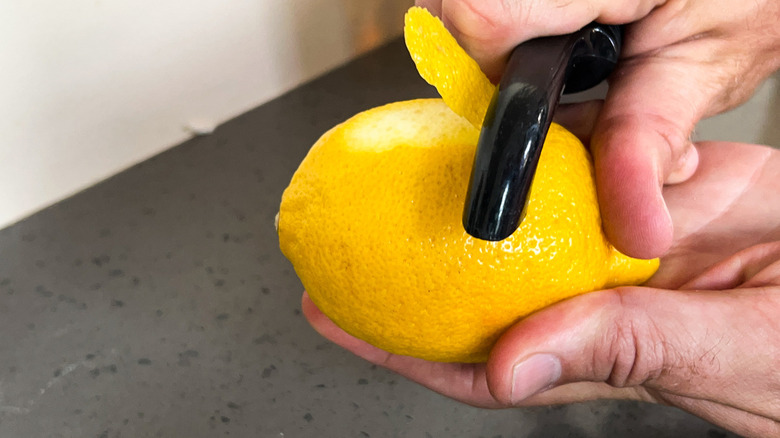peeling lemon for garnish