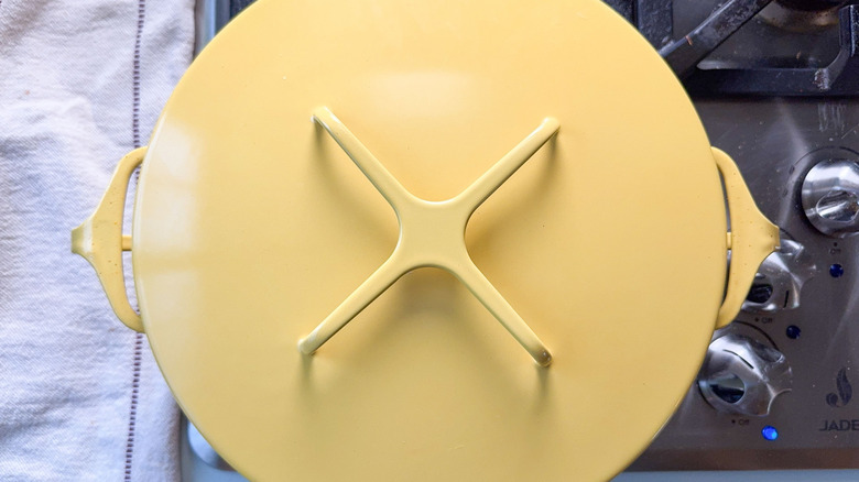 Covered yellow pot on stovetop