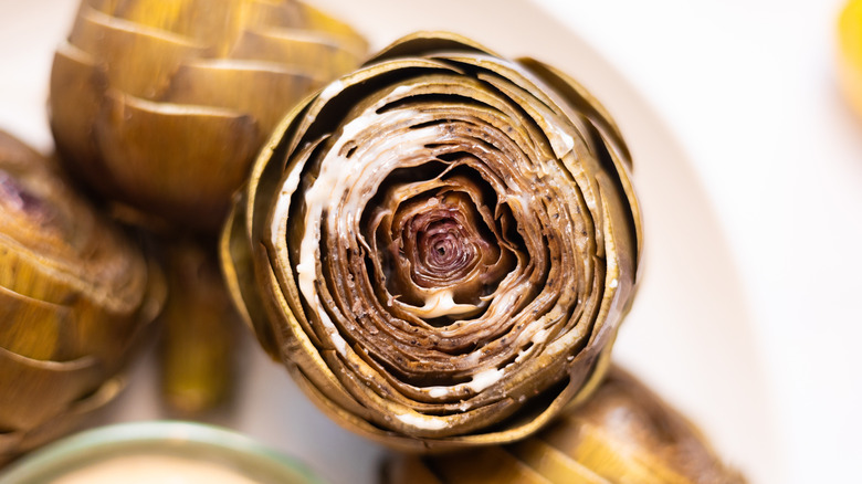 butter on steamed artichokes, view of core