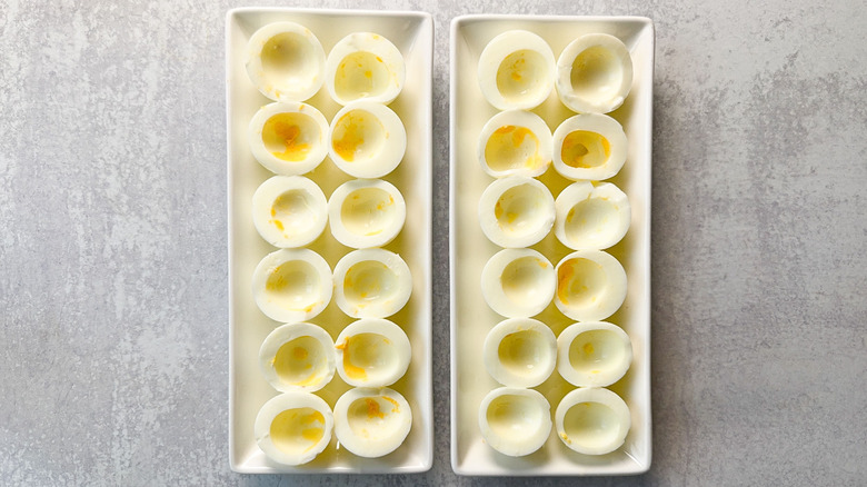Hard boiled egg white shells on platters
