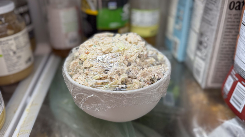 Triple anise chicken salad in bowl in refrigerator