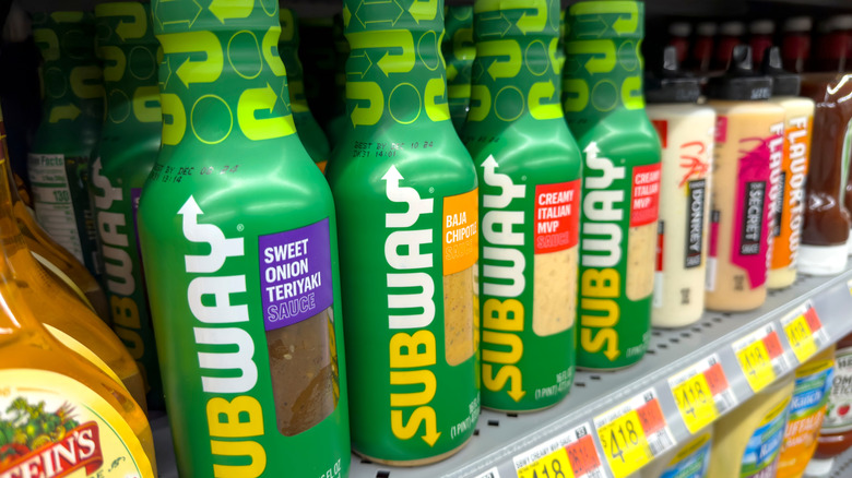 Bottles of Subway sauces on a shelf in a grocery store