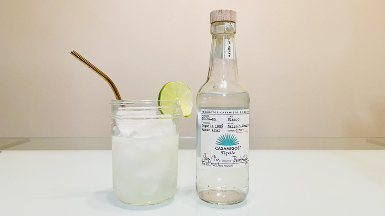 Bottle of Casamigos tequila with a margarita