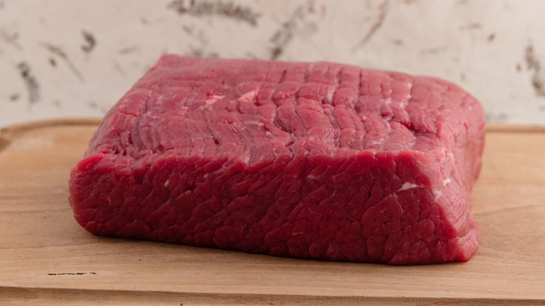 Thawed beef brisket on countertop