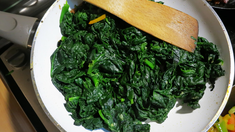 cooking spinach in pan