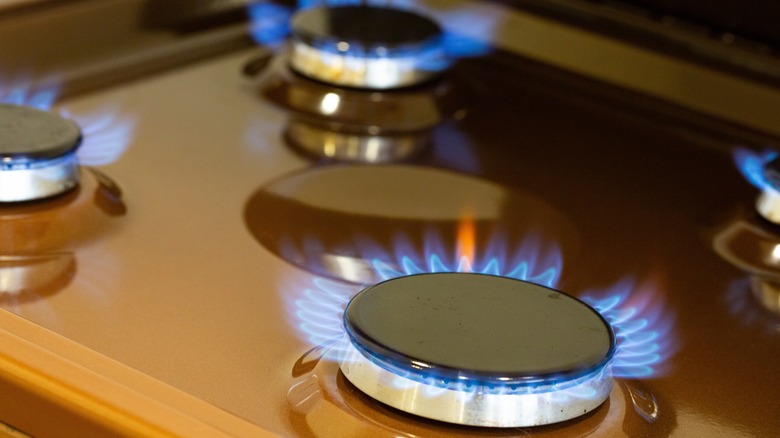 Close up of gas burners on stove top