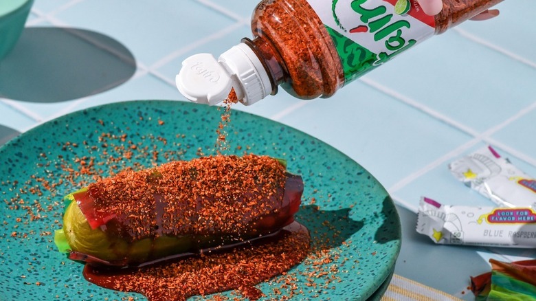 Pickle covered in Tajin seasoning and chamoy
