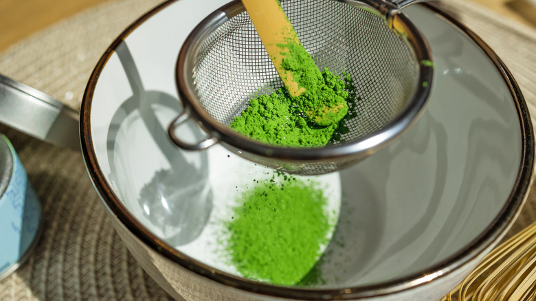 matcha sifted into bowl