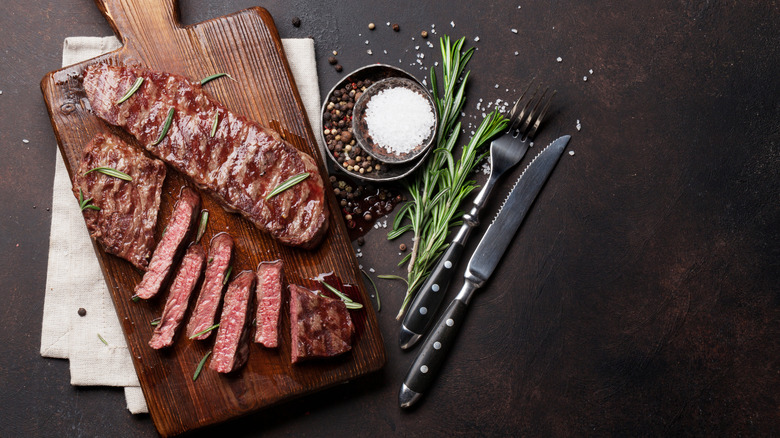 Top blade steak on board