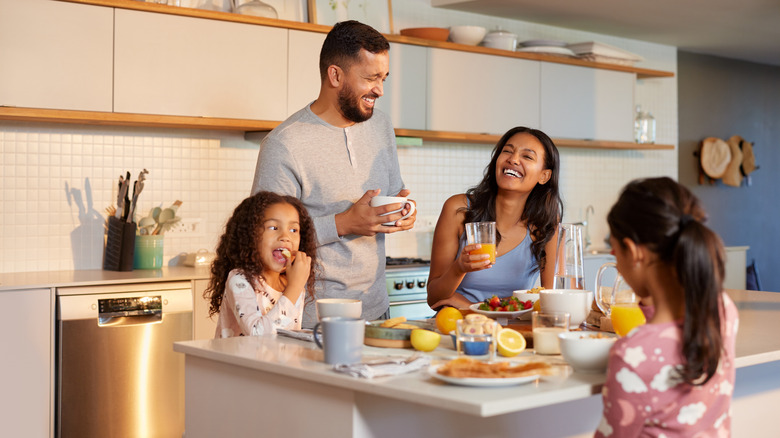 family eating breakfast around kitchen island