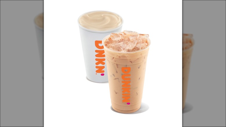 A cold chai latte and a hot chai latte against a white background