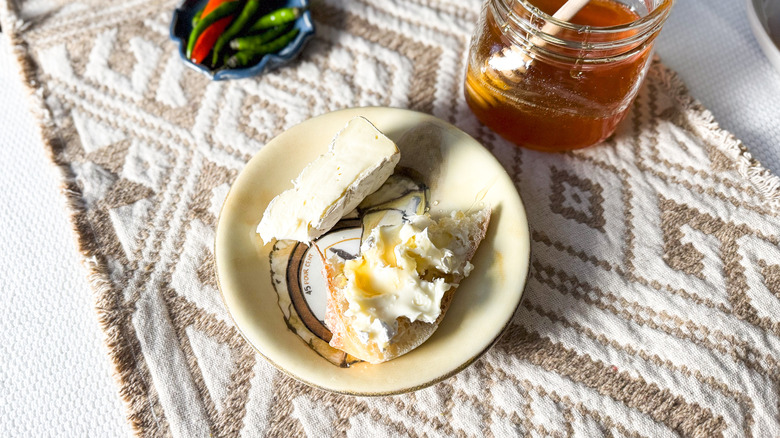 Homemade hot honey on soft cheese on toast