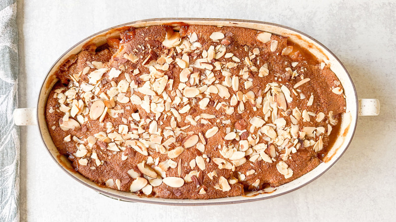 Gluten-free peach cobbler in oval baking dish