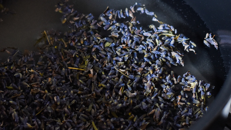 lavender syrup in measuring cup