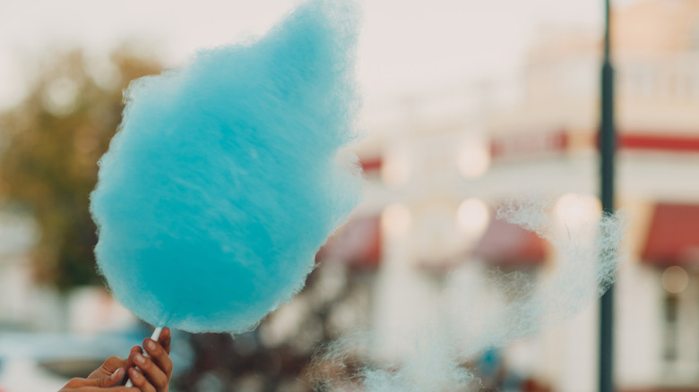 Blue cotton candy being made