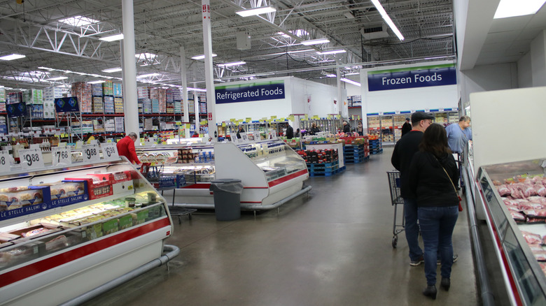 People shopping for meat at Sam's Club