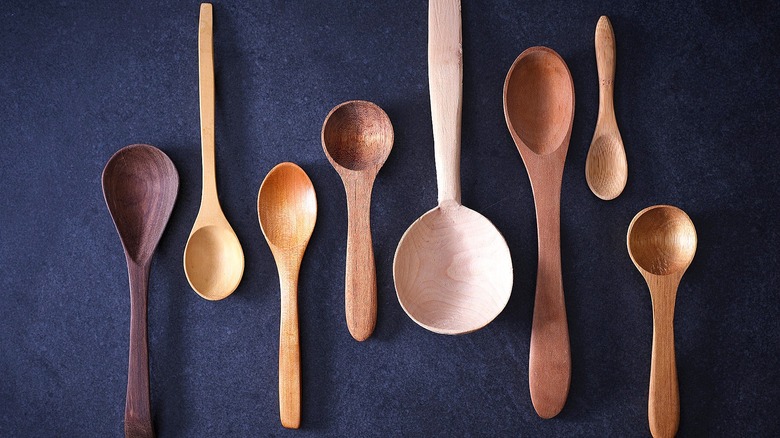 Various wooden spoons on a black background