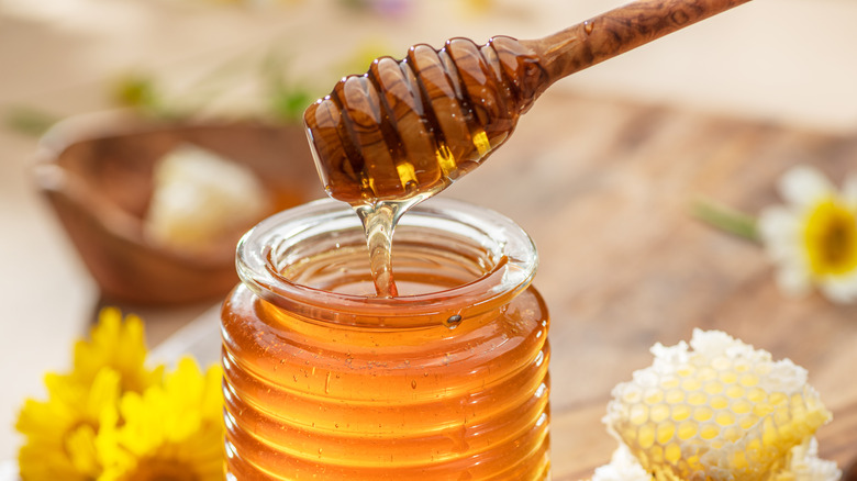 A glass jar of honey